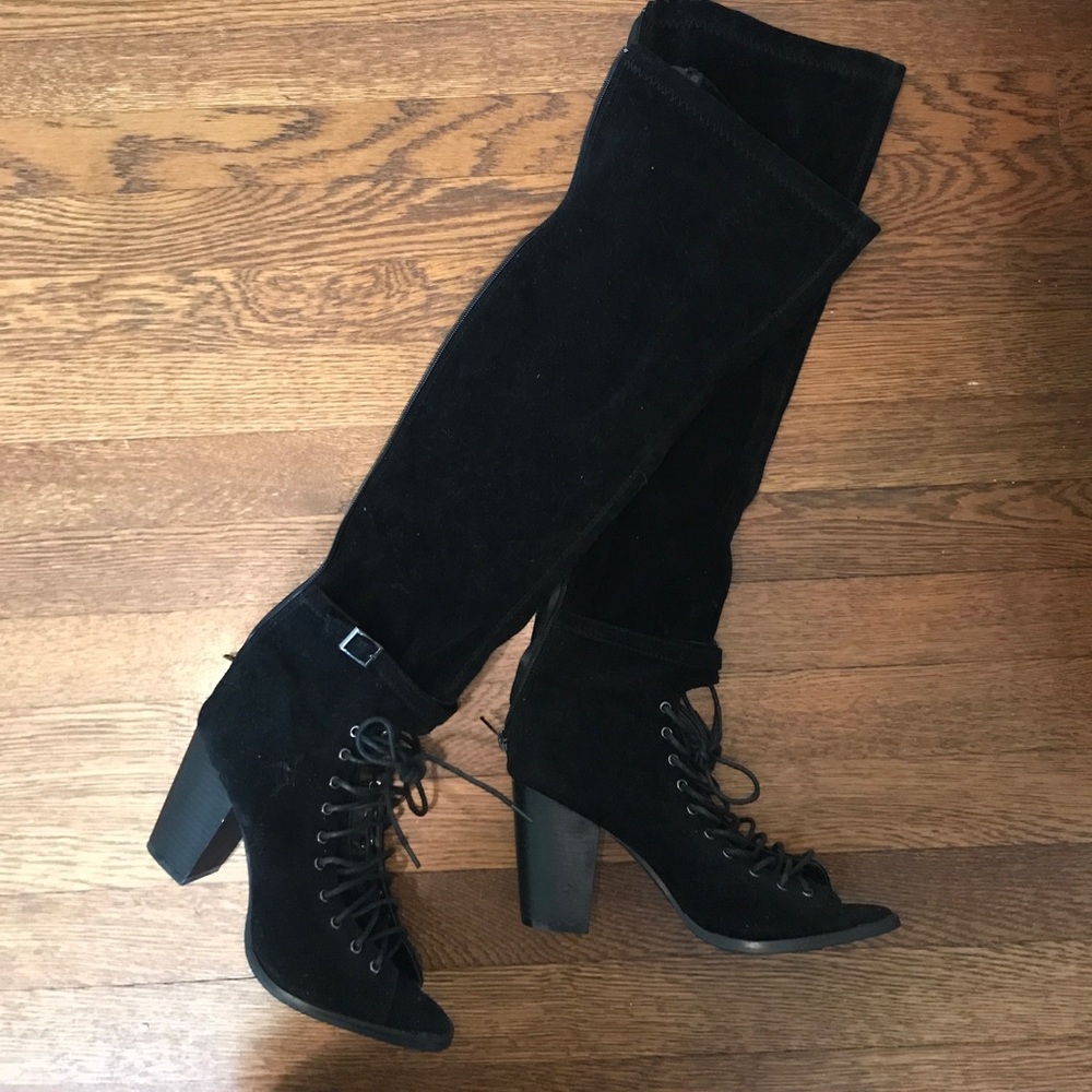 Black suede open toe boots.